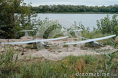 Preparing the army drones for the mission. A pair of reconnaissance aircraft in the wild. Stock Photo