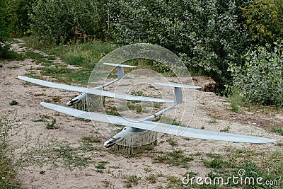 Preparing the army drones for the mission. A pair of reconnaissance aircraft in the wild. Stock Photo