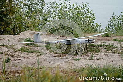 Preparing the army drones for the mission. Reconnaissance aircraft in the wild. Stock Photo