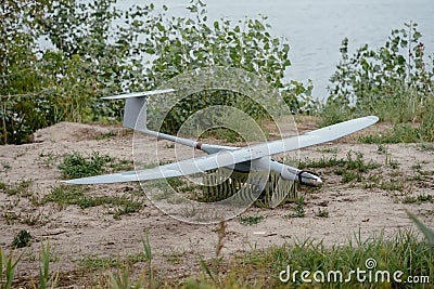 Preparing the army drones for the mission. Reconnaissance aircraft in the wild. Stock Photo