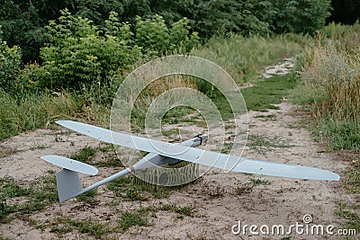 Preparing the army drones for the mission. Reconnaissance aircraft in the wild. Stock Photo