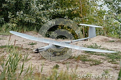 Preparing the army drones for the mission. Reconnaissance aircraft in the wild. Stock Photo