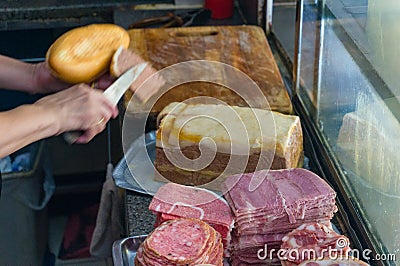 Preparing banh mi, asian bread roll, sandwich with meat and pate Stock Photo