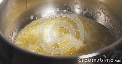 Preparing bechamel sauce adding flour Stock Photo