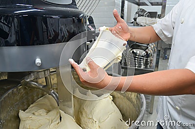 Preparing bread dough on table in a bakery Stock Photo