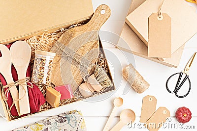 Preparing care package, seasonal gift box with plastic free, zero waste kitchen utensils. Stock Photo