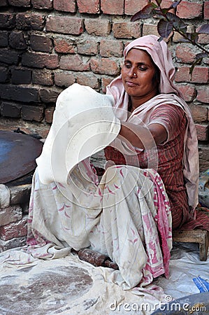 Preparing chapatti Editorial Stock Photo