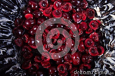 Preparing clafouti swett cherry cake, pie. Buttered cake pan with prepared fruits. Top view Stock Photo