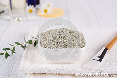 Preparing cosmetic mud mask with various skincare products. Dry clay powder in bowl. Natural cosmetics for home or salon spa treat Stock Photo