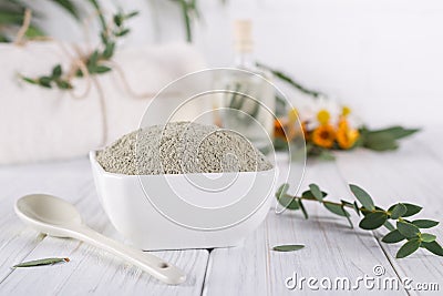 Preparing cosmetic mud mask with various skincare products. Dry clay powder in bowl. Natural cosmetics for home or salon spa treat Stock Photo