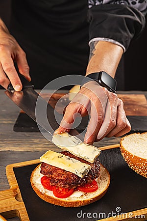 Preparing delicious burgers Stock Photo