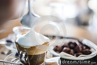 Preparing delicious cappuccino in the restaurant Stock Photo