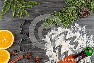 Preparing festive treats for Christmas and new year holidays. cookie molds and flour. orange and star anise Stock Photo