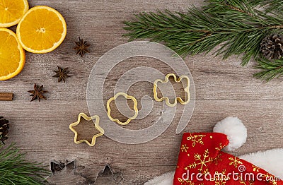 Preparing festive treats for Christmas and new year holidays. cookie molds and flour. orange and star anise Stock Photo