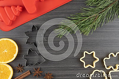 Preparing festive treats for Christmas and new year holidays. cookie molds, orange and star anise Stock Photo