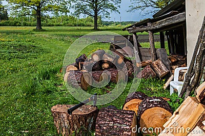 Preparing firewood in rural countryside Stock Photo