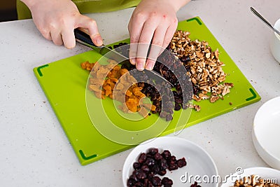 Preparing granola in the kitchen at home Stock Photo