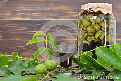 Preparing green walnut liqueur Stock Photo