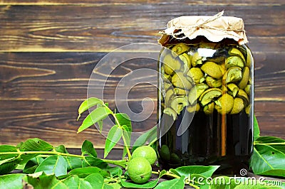 Preparing green walnut liqueur Stock Photo