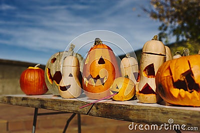 Preparing for Halloween, cleaning and carving faces on pumpkins. Stock Photo
