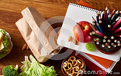 Preparing ham sandwiches for scool lunchbox on wooden background, close up. Stock Photo