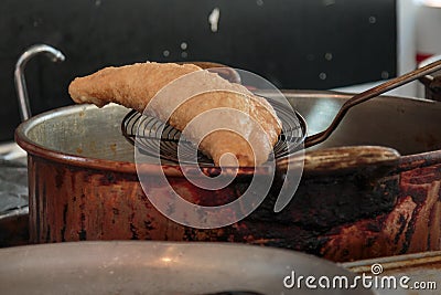 Preparing Italian Fried Stuffed Calzone Stock Photo