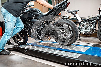 Preparing for the motorcycle repairment in the workshop Stock Photo