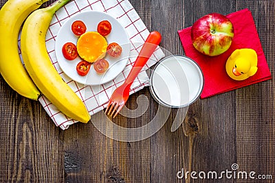 Preparing quick lunch for schoolchild. Fruits on dark wooden table background top view copyspace Stock Photo