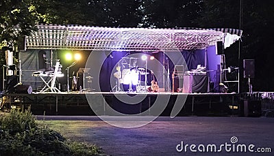 Preparing of a scene for a musical group for a night concert. Editorial Stock Photo