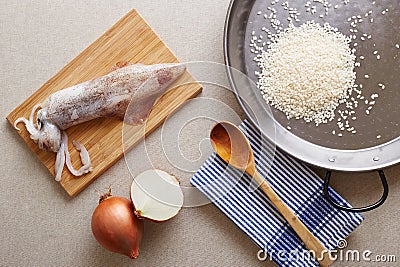 Preparing squid rice paella ingredients Stock Photo