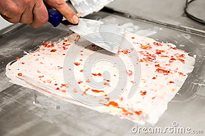 Preparing strawberry rolled ice cream. Stock Photo