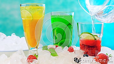 Preparing Summer Spritzer drinks with fresh fruit with sparkling mineral water. Stock Photo