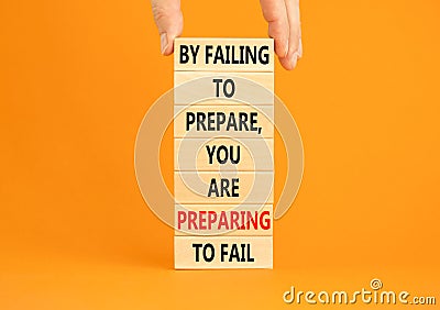 Preparing symbol. Concept words By failing to prepare you are preparing to fail on wooden blocks on a beautiful orange background Stock Photo