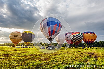 Preparing to the evening flight of the hot air Editorial Stock Photo