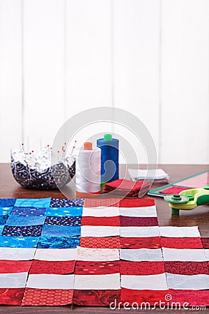 Preparing to sewing of pieces of fabrics that look like a flag of USA Stock Photo