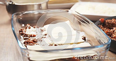 Preparing traditional italian lasagna adding pasta Stock Photo