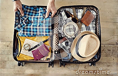 Preparing travel suitcase high angle view Stock Photo