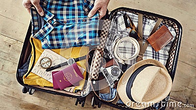 Preparing travel suitcase high angle view Stock Photo