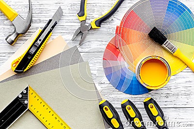 Preraring for home repair. Tools on grey wooden desk background top view Stock Photo
