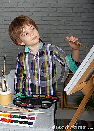 Preschool boy learns to think creatively Stock Photo