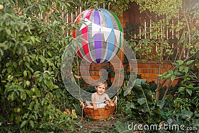 Preschool boy traveling. Child playing in pretend hot air balloon. Stock Photo