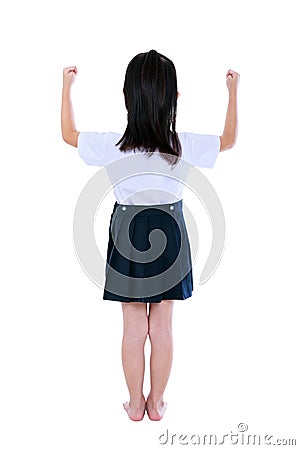 Preschool child in uniform with her hands up at studio. Isolated Stock Photo