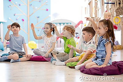 Preschool children on speech therapy lesson in kindergarten Stock Photo