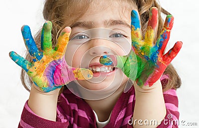 Preschool girl with painted hands Stock Photo