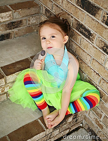 Preschool girl with tutu and candy sucker Stock Photo
