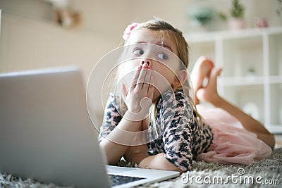 Preschool little girl with laptop. Stock Photo