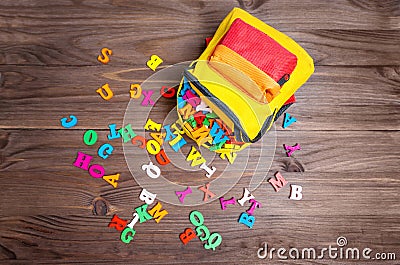 Preschool Season Start: Tiny Backpack Stuffed with Letters Stock Photo