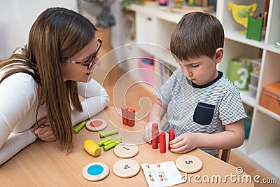 Preschool Teacher with Kid Having Creative Educational Activities Stock Photo