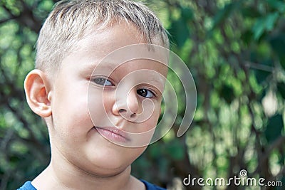 Preschooler boy grimaces making weird face expressions Stock Photo