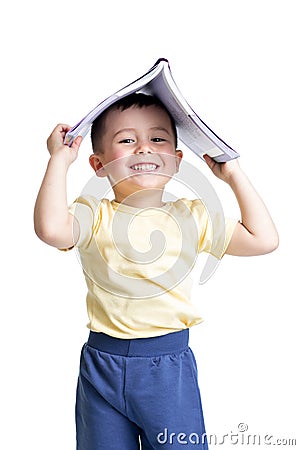 Preschooler child with a book over his head Stock Photo